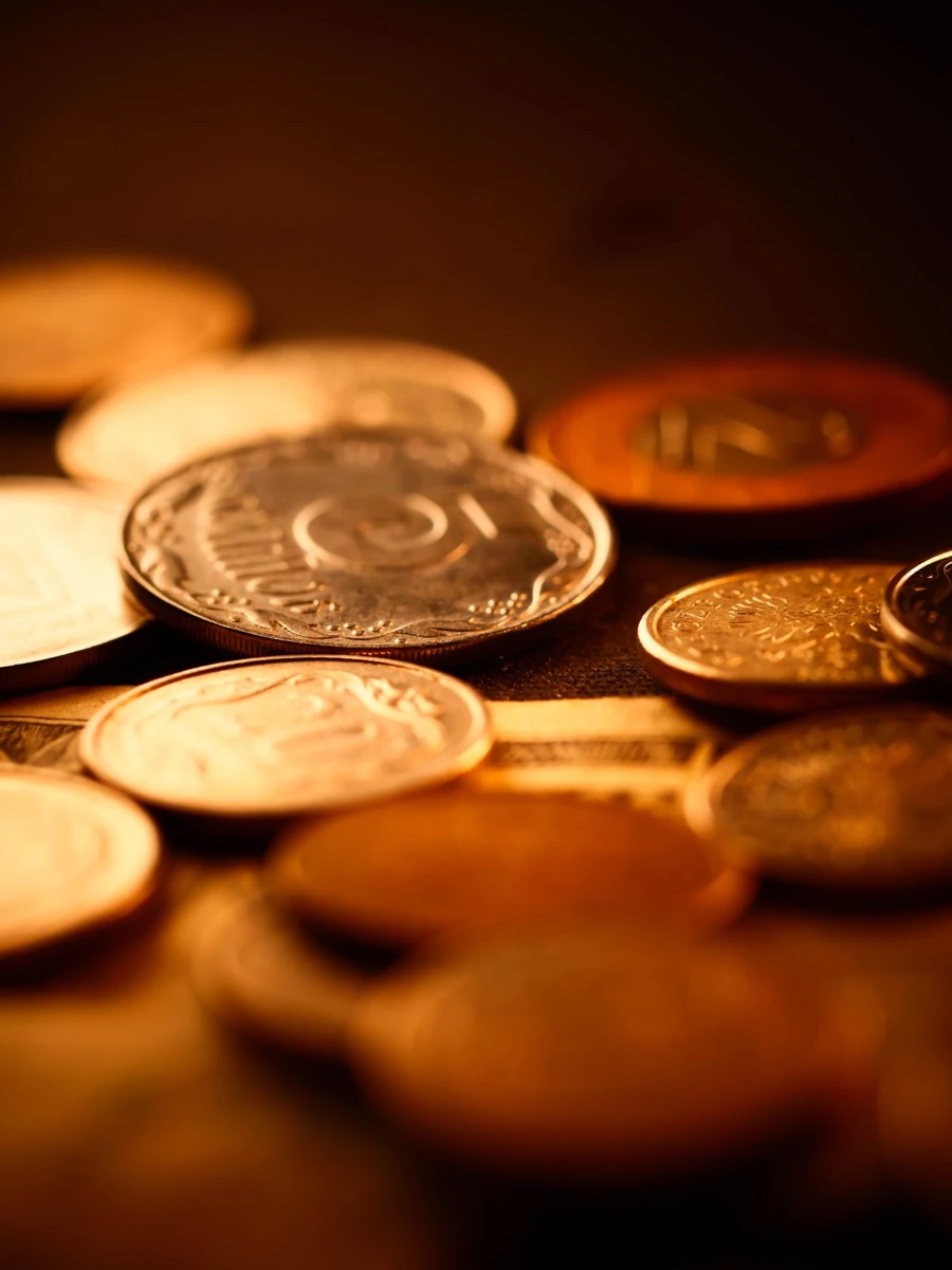 A close-up of physical gold coins